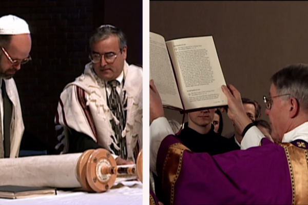 Image shows reading of the Torah and a priest holding up the Bible.